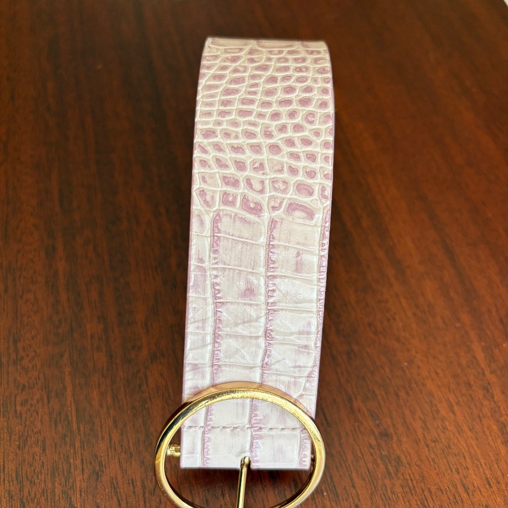 B-Low the belt.Small pink leather.